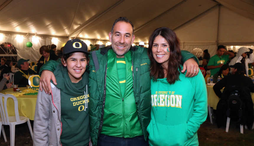 family gathers at UO Tailgate party