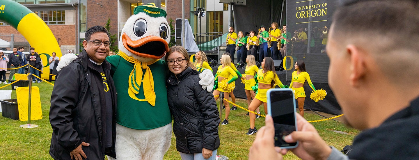 Parent and student with The Duck at Homecoming Pep Rally